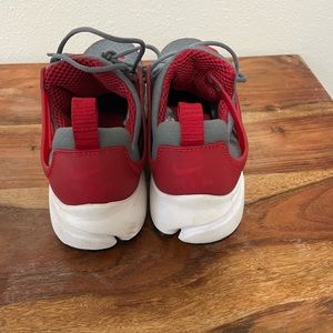 Nike running shoe. Red and grey